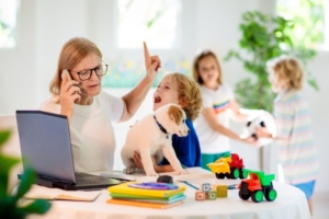 Busy Mom Juggling Administrative Tasks and caring for her children